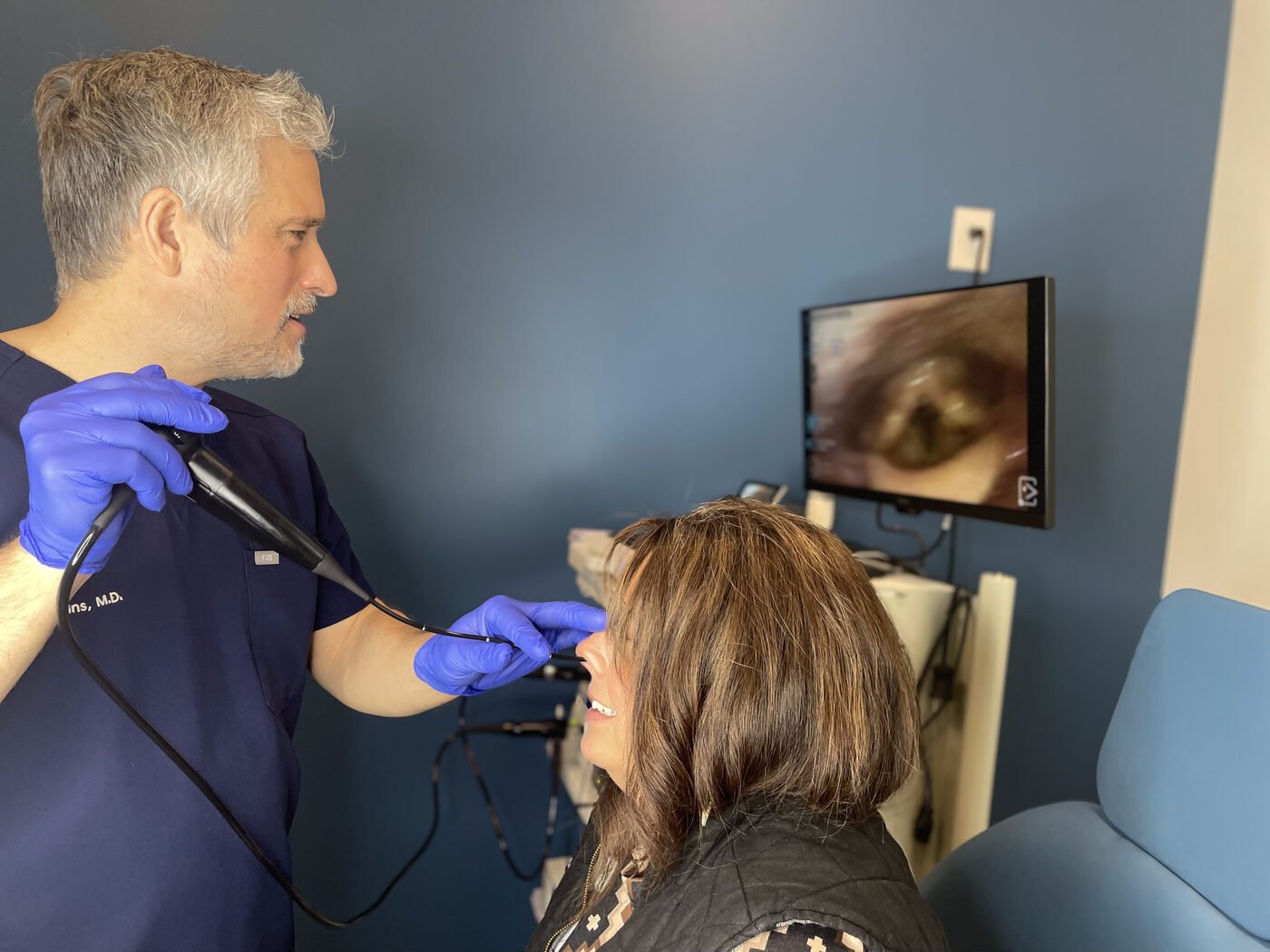 Dr. Fewins examining a patient in his Fort Worth office