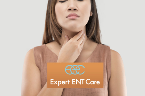 A woman touching her throat, indicating she might need ENT care in Fort Worth, Texas
