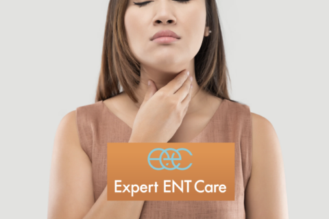 A woman touching her throat, indicating she might need ENT care in Fort Worth, Texas